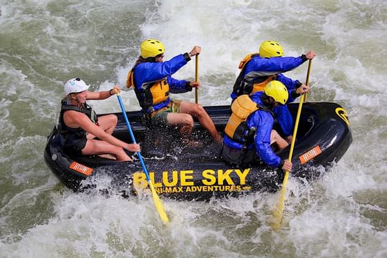 People whitewater rafting