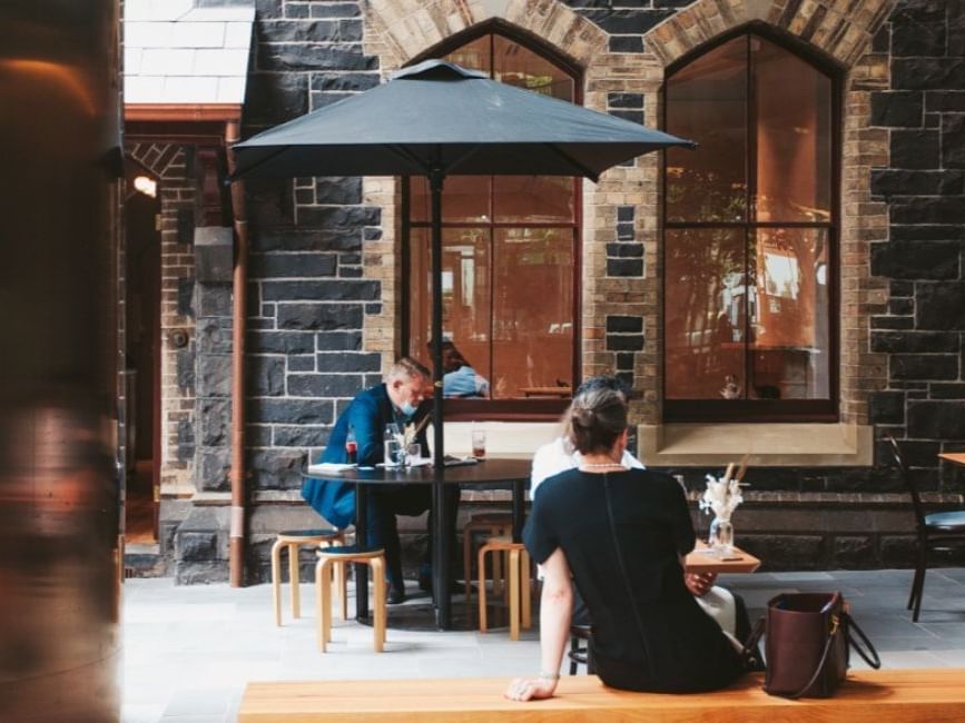 People having drinks outdoors in The Manse Coffee at Brady Hotels Jones Lane