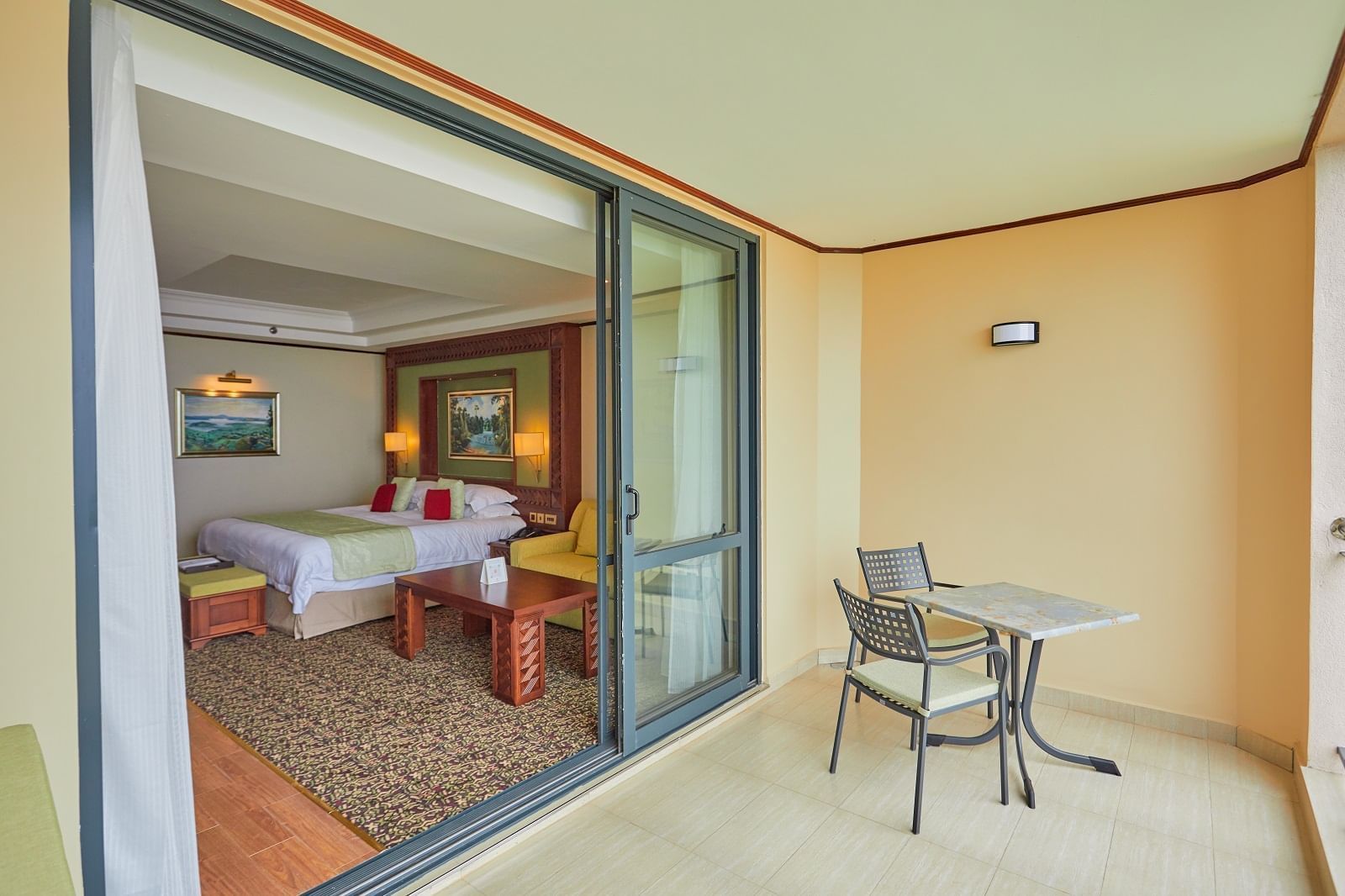 Balcony lounge area in King Deluxe Room at Goma Serena Hotel