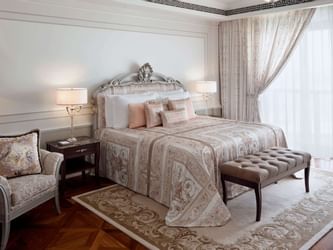 Grand Suite with king bed, table lamps at Palazzo Versace