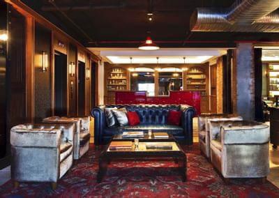 a couch and chairs in a lounge
