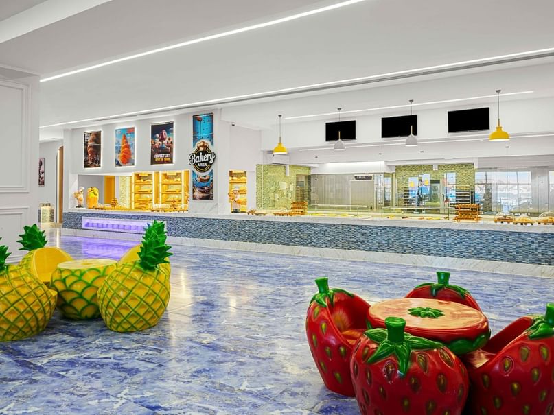 Bakery bar with pineapple and strawberry chairs at Pickalbatros Jungle Aqua Park Resort - Neverland Hurghada.