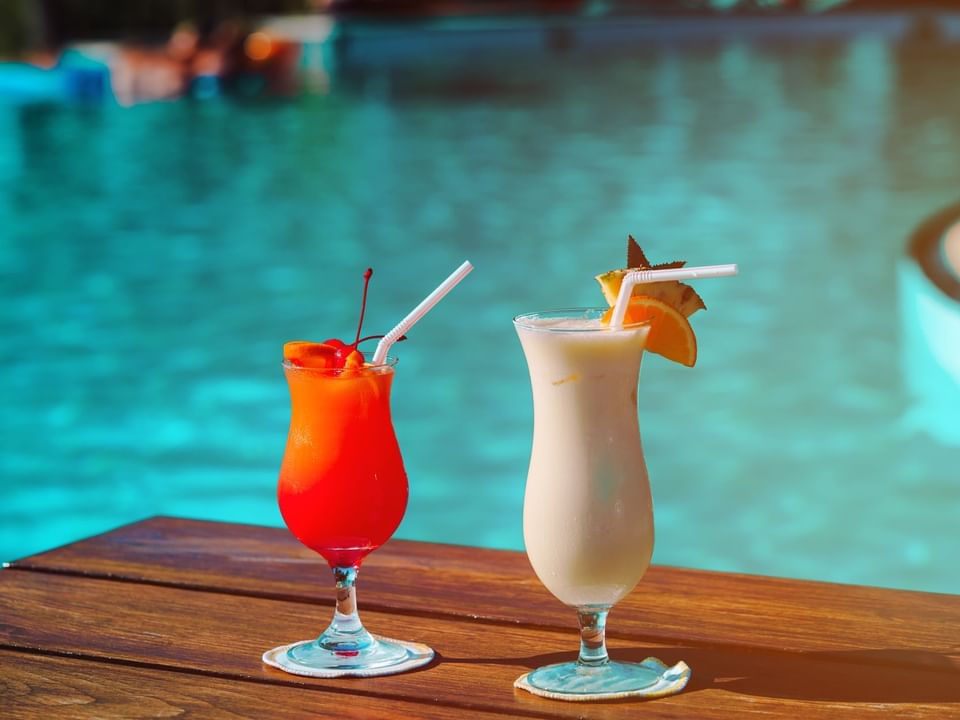 Cocktails served by the outdoor pool area in Oasis Bar & Grill at Las Casitas Village