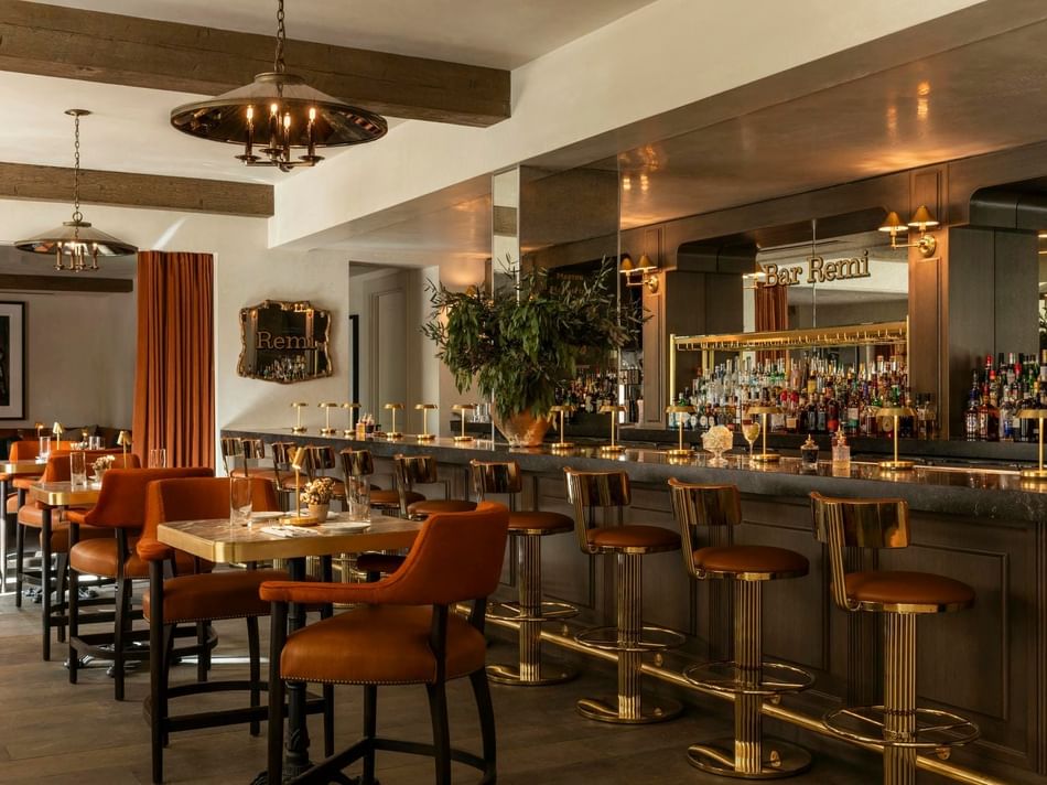 Remi Bar, Uptown Park, Houston restaurants with a wooden bar, leather seating, and warm lighting at Granduca Houston