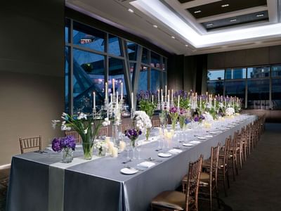Sora Room with a dining table at Okura Prestige Bangkok