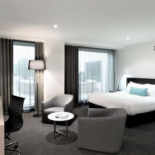 King bed, desk & lounge in Superior Room at Como Melbourne
