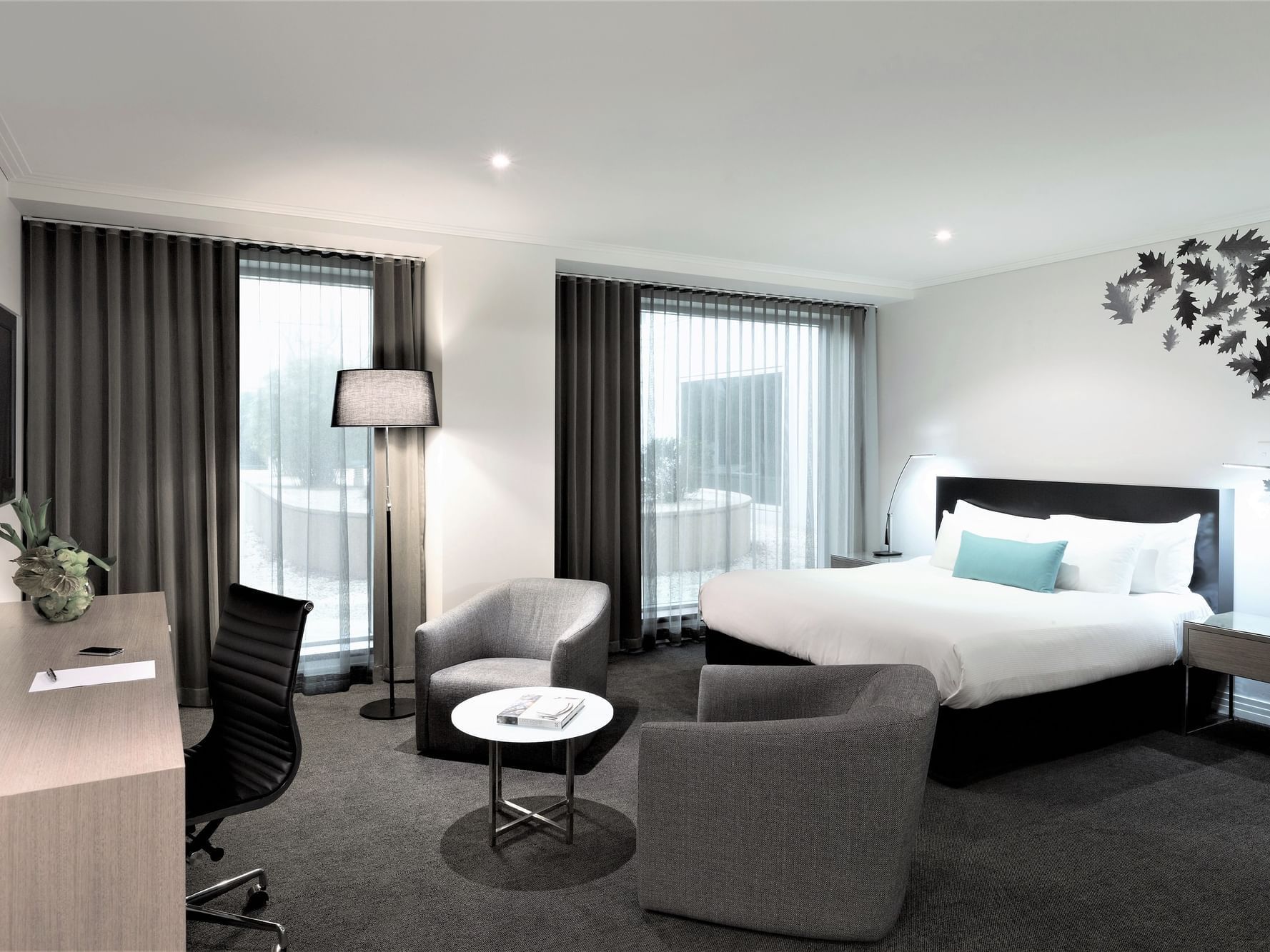 King bed, desk & lounge in Superior Room at Como Melbourne