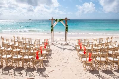 An outdoor wedding set-up by the sea at Bougainvillea Barbados