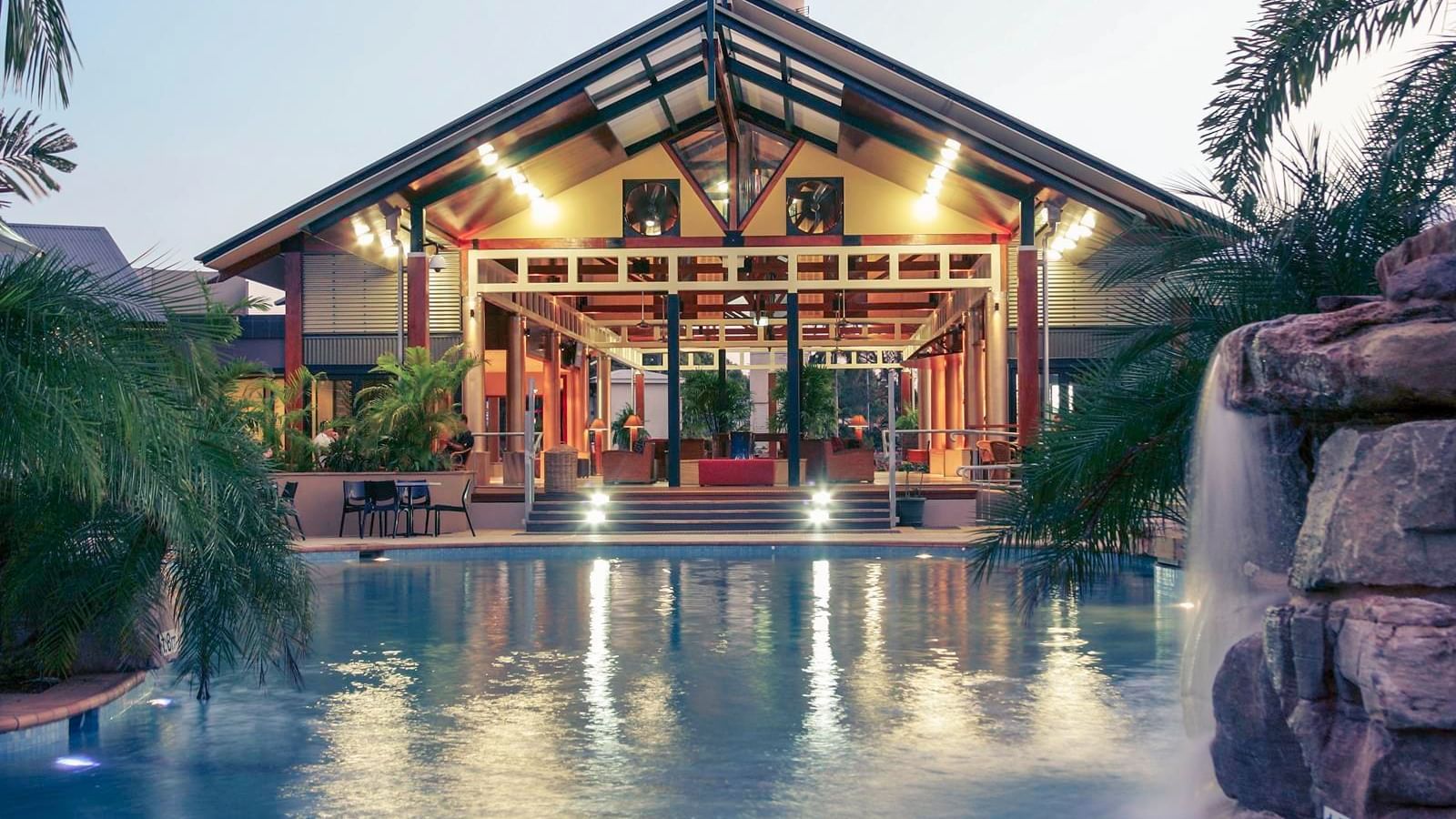 Night view of the outdoor pool at Novotel Darwin Airport