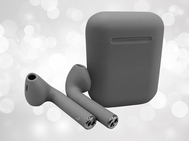 Grey wireless earbuds and case against a silver background