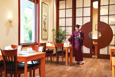 Waitress arranging tables in a Restaurant at Hanoi Daewoo Hotel