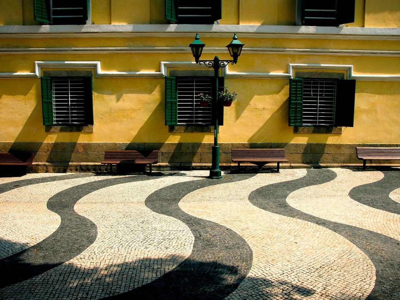 Yellow color wall with Green windows of Artyzen Grand Lapa