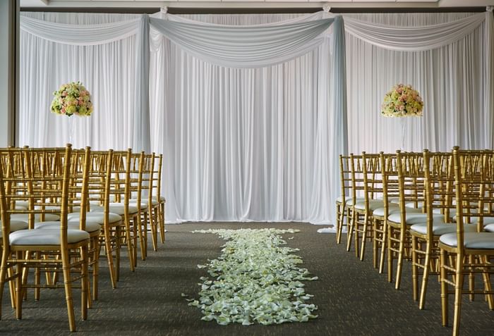 flowers down the middle of a wedding ceremony