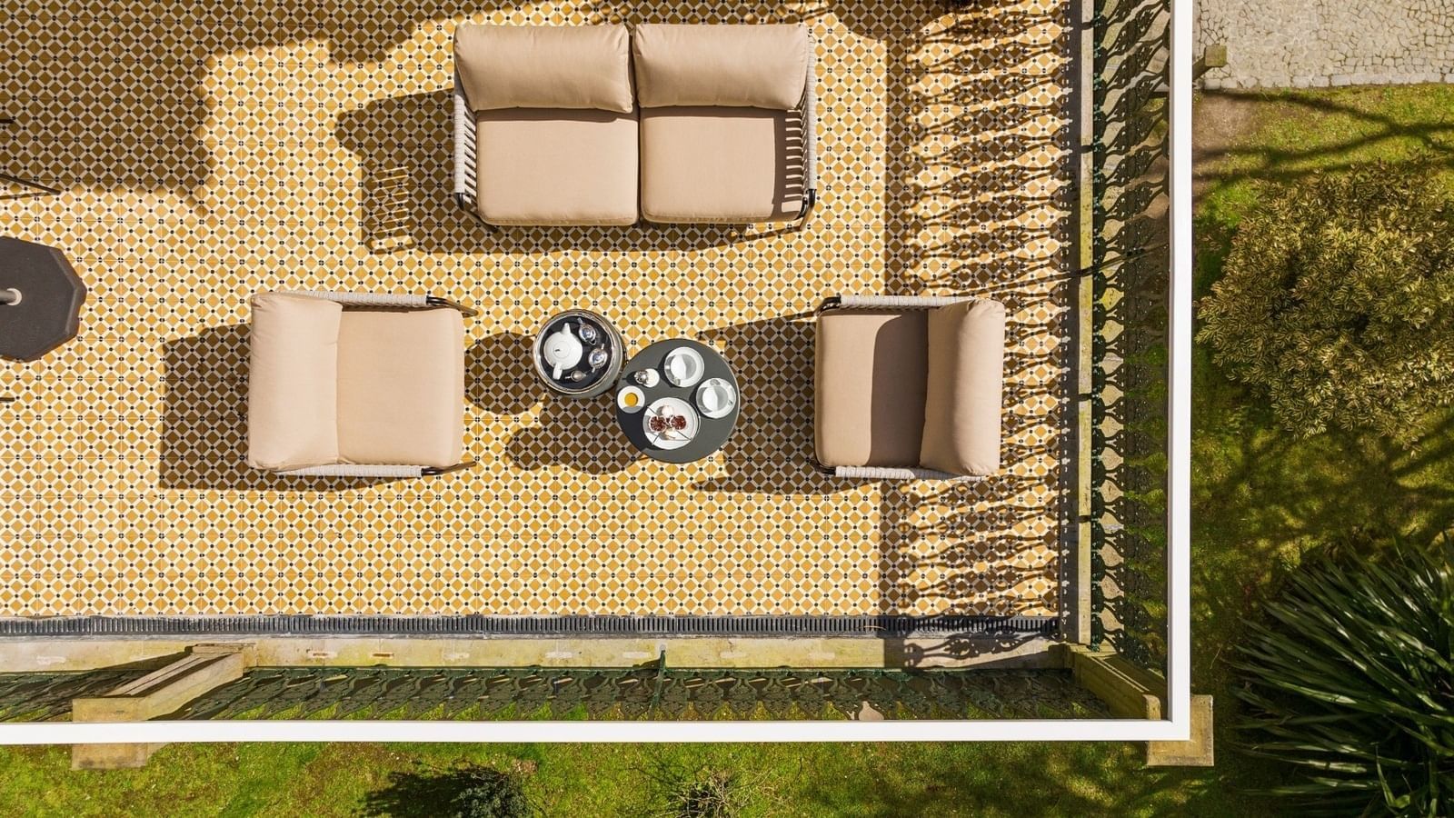 Top view of the balcony lounge area on a sunny day in a Villa at Bensaude Hotels Collection