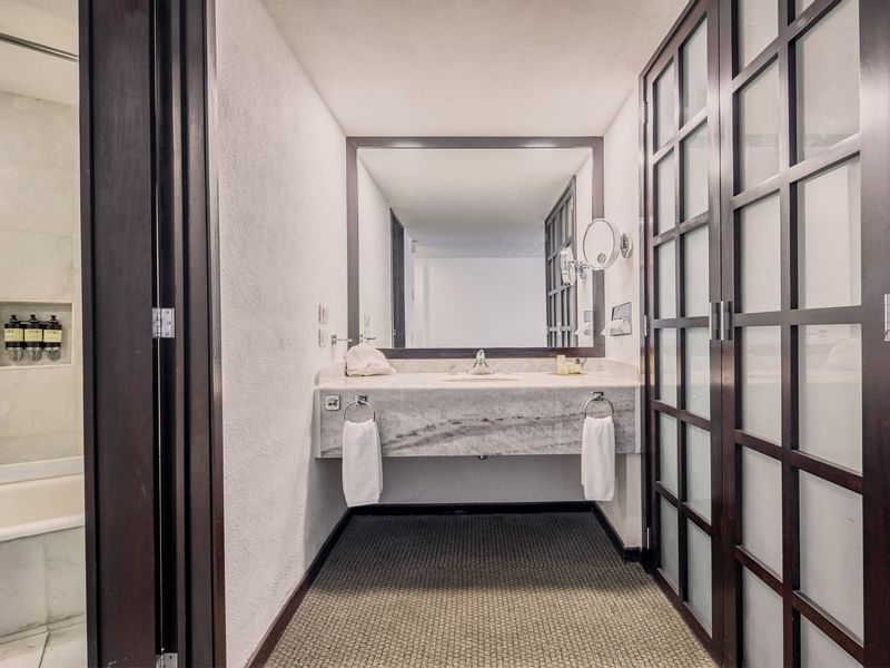 Standard Room, bathroom vanity & tub at Fiesta Americana Hotels