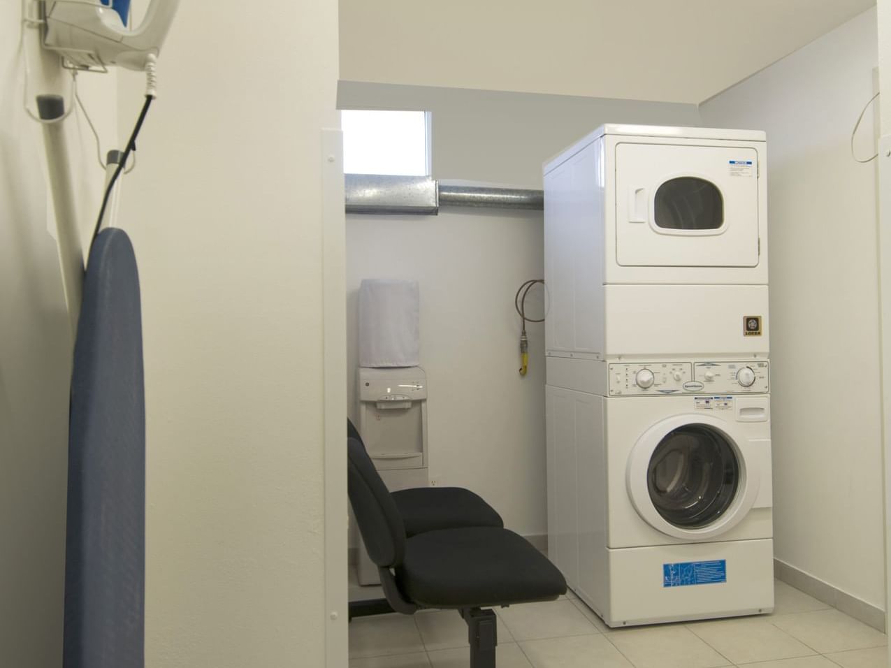 Washing machine & an Ironing Board, Laundry Room, One Hotels