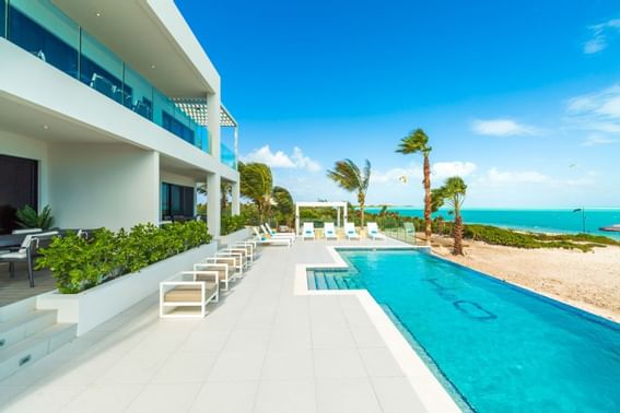 Pool area with benches & sunbeds at H2O Life Style Resort