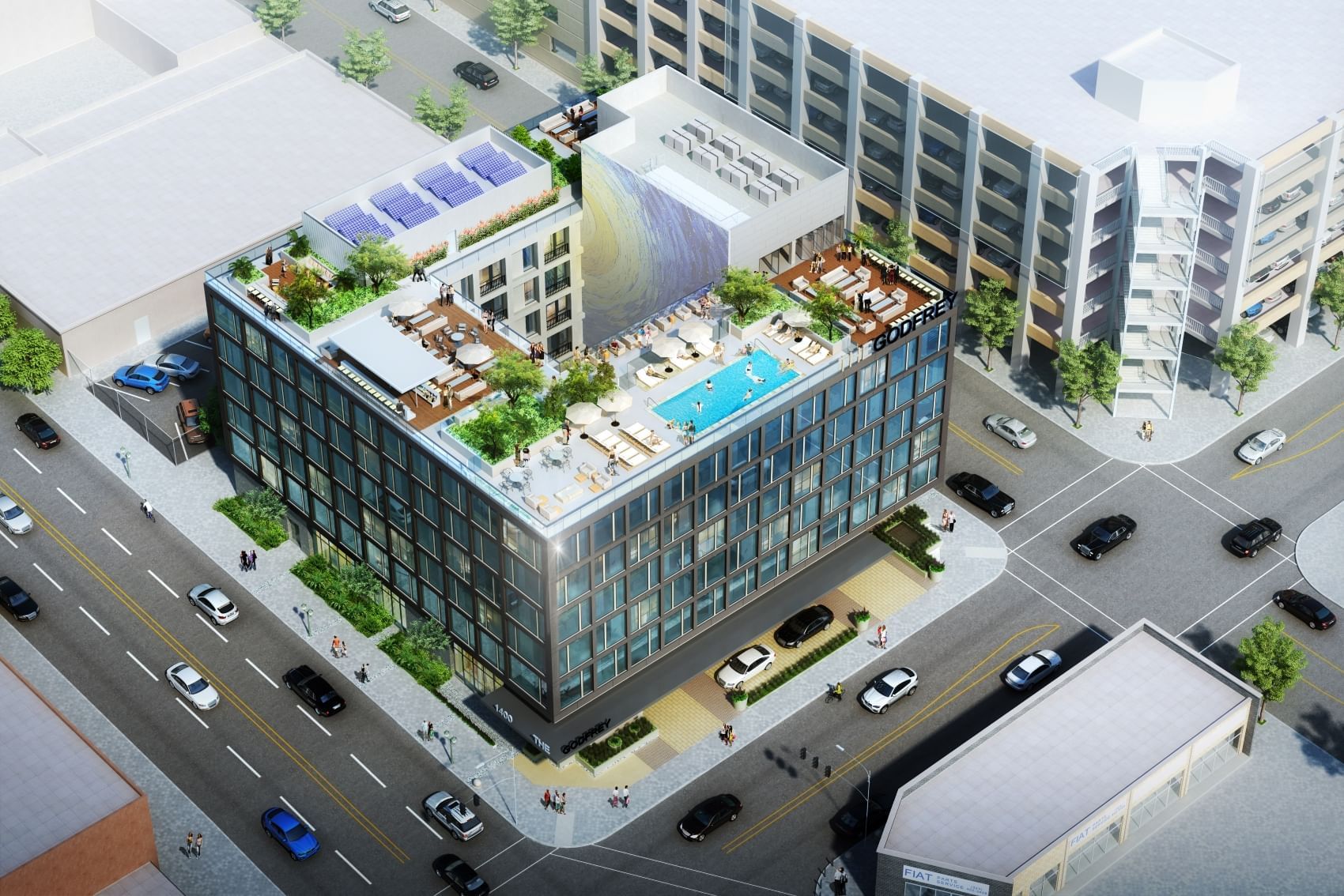 An aerial view of a modern building with a rooftop pool and lounge area.