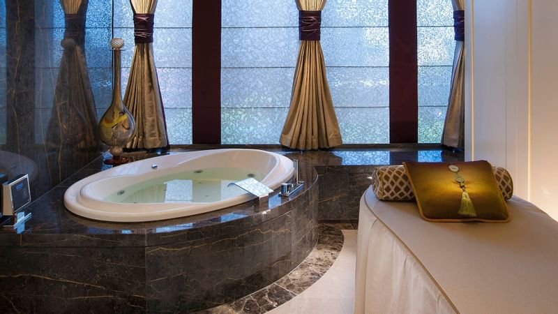 A massage bed & hot tub in a Crow Spa at Crown Hotels