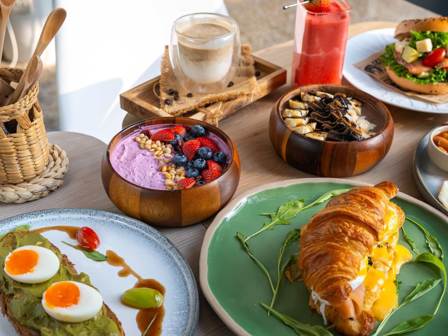 A variety of dielicious breakfast and smoothie bowls on the table