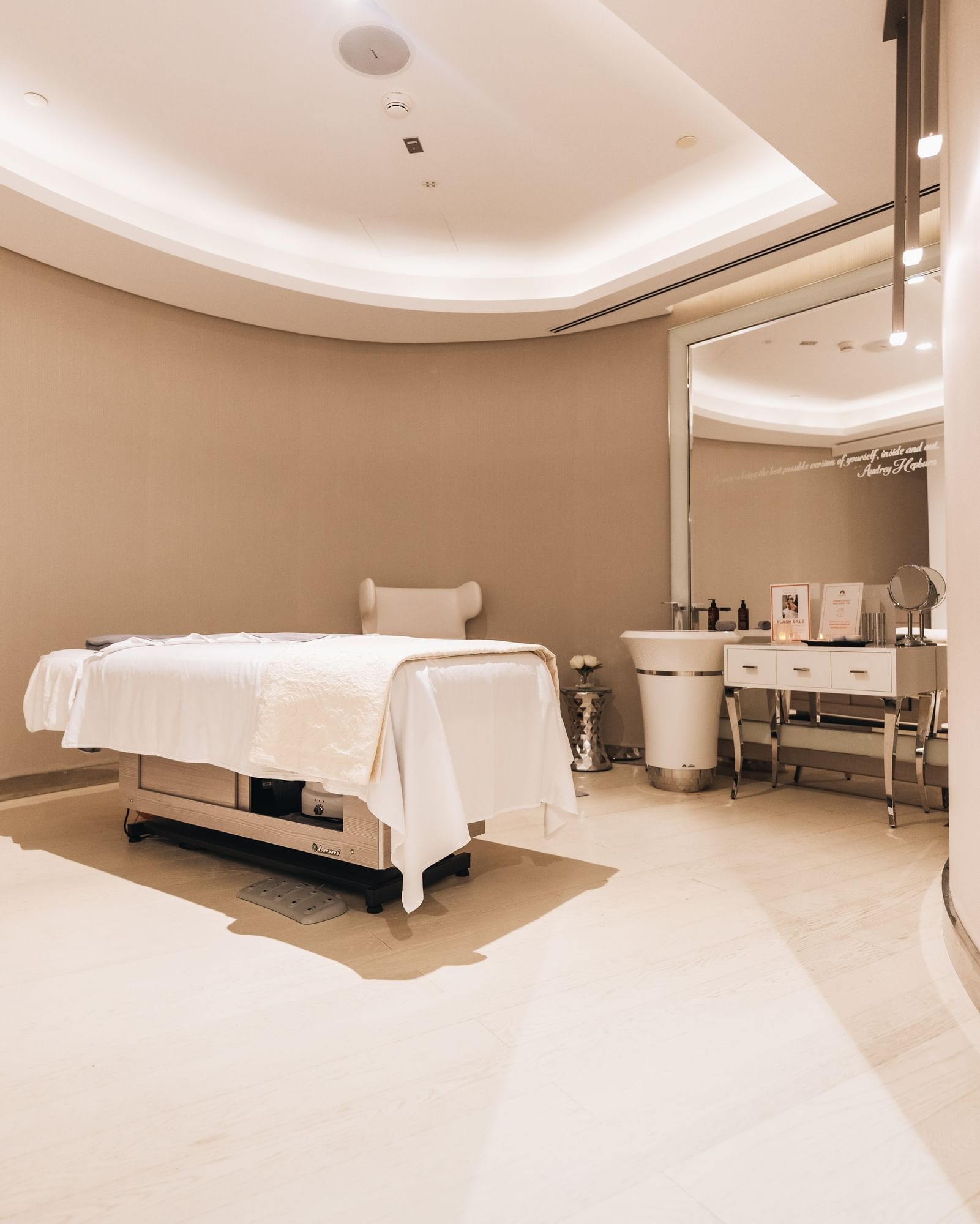 Massage bed with large mirror & amenities in Pause Spa at Paramount Hotel Dubai