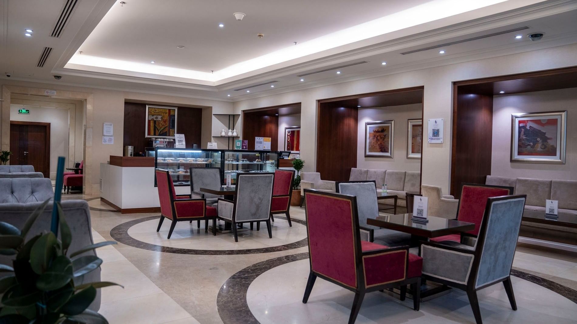 Elegant All-Day Dining Restaurant with tables and chairs at Saja by Warwick Makkah in Makkah.