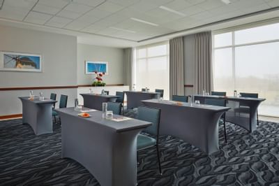 Tall tables and chairs in a meeting room