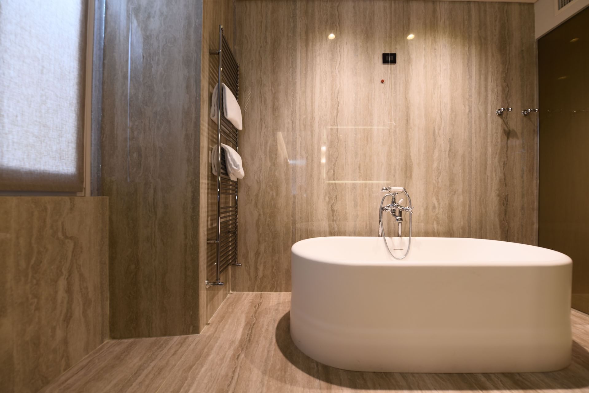 Bathroom Vanity & amenities featuring bathtub in Deluxe Room at Margutta 19