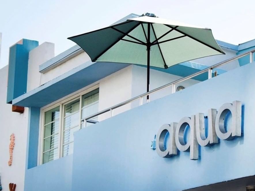Closeup of the sign letters of Aqua Hotel on the building