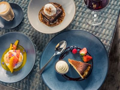 Desserts, latte & wine served in Richardson's Bistro at Freycinet Lodge