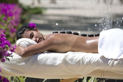 A lady under outdoor Spa session at Playa Blanca Beach Resort