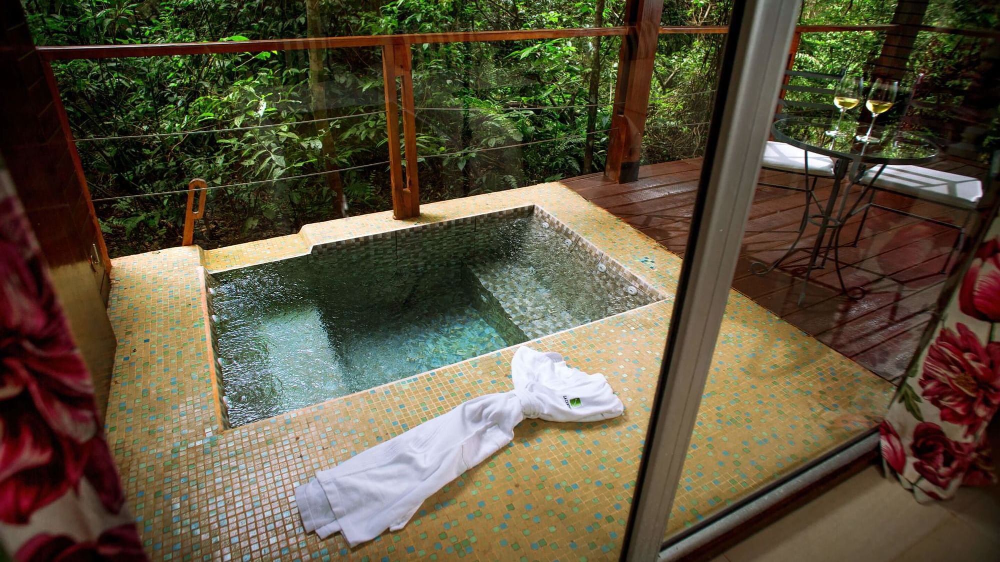 A jacuzzi on the balcony in Vila Room at DOT Hotels