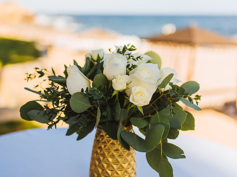 Close-up of a vase of white roses in a wedding at Live Aqua Resorts and Residence Club