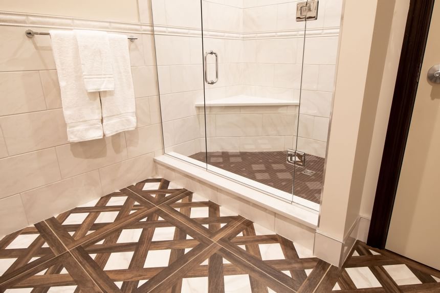Shower cubicle & towel rack in King Premiere Library at Retro Suites Hotel