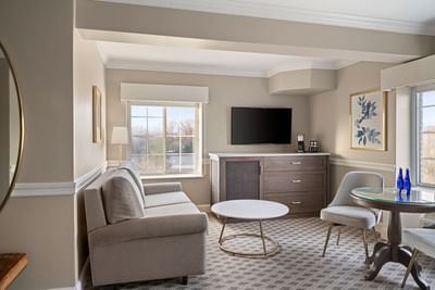 Sofa with table & TV in Madison Suite at The Madison Hotel