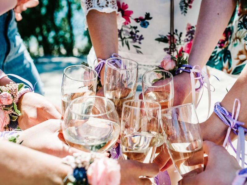 Girls toasting glasses of champagne at Live Aqua Resorts