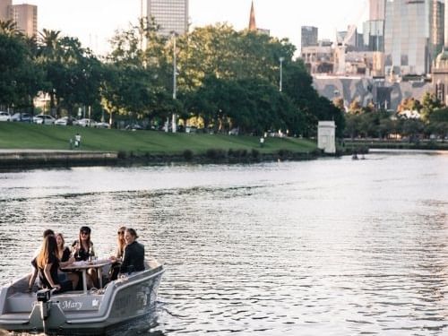 People riding in a boat on the Yarra River