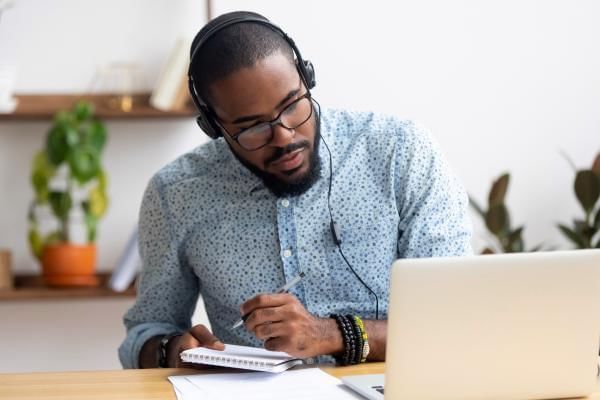 Man listening to music in the workplace whilst working