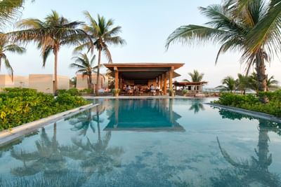 Pool bar by the pool with a sea view at Marea Beachfront Villas