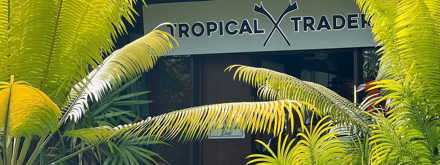 Tropical Trader shop entrance with lush greenery at The Naviti Resort in Korolevu