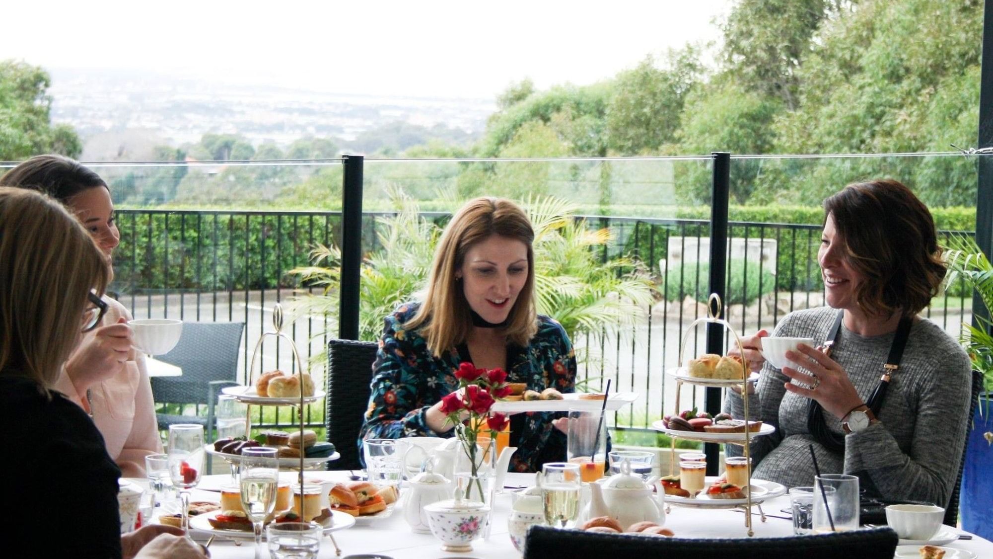Women having afternoon tea at Mercure Charlestown.