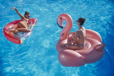 Two girls enjoying in Vertigo Pool at St George Lycabettus