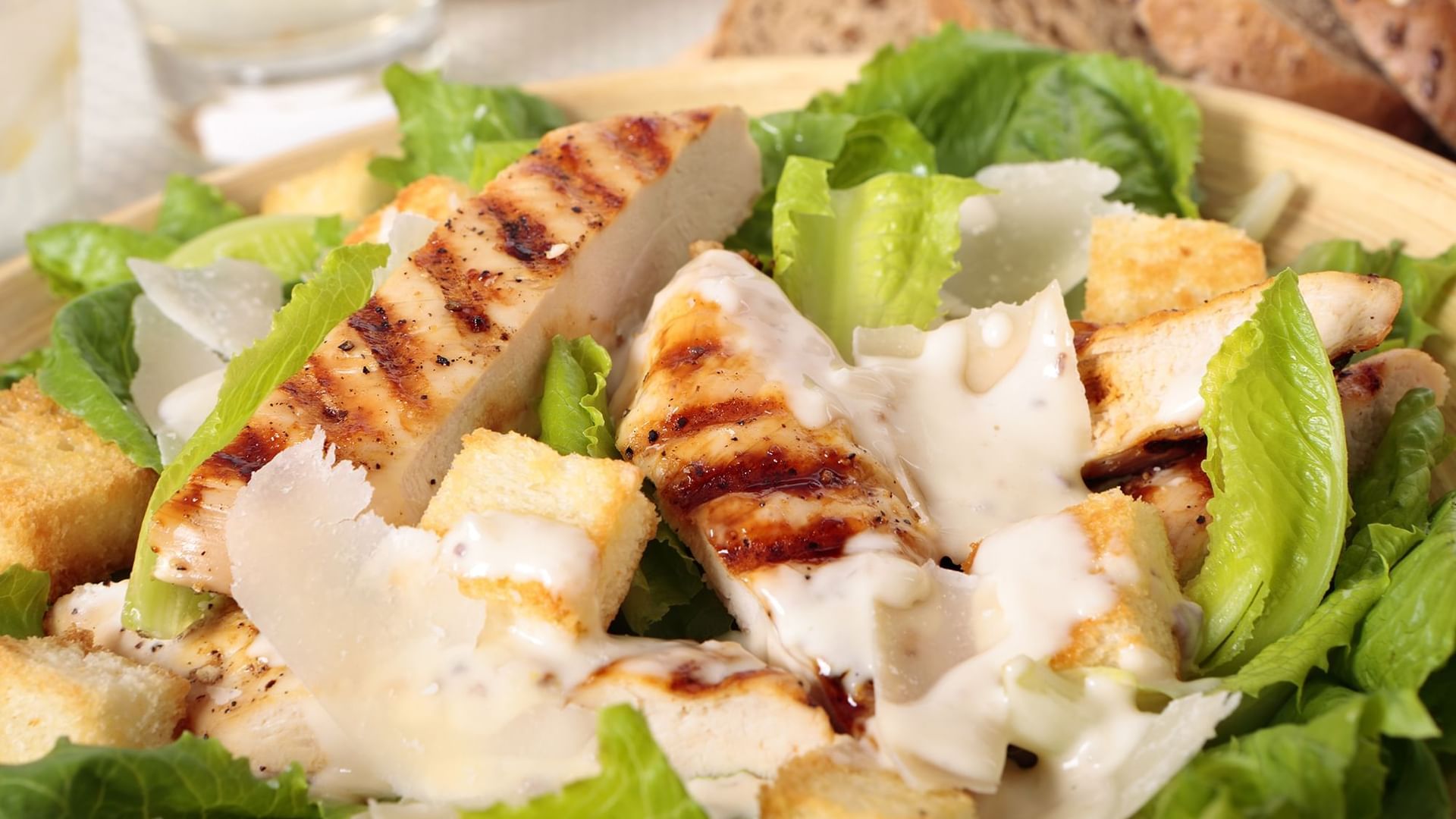 Grilled chicken strips with crispy croutons under creamy dressing in By the Pool at Warwick Melrose Dallas