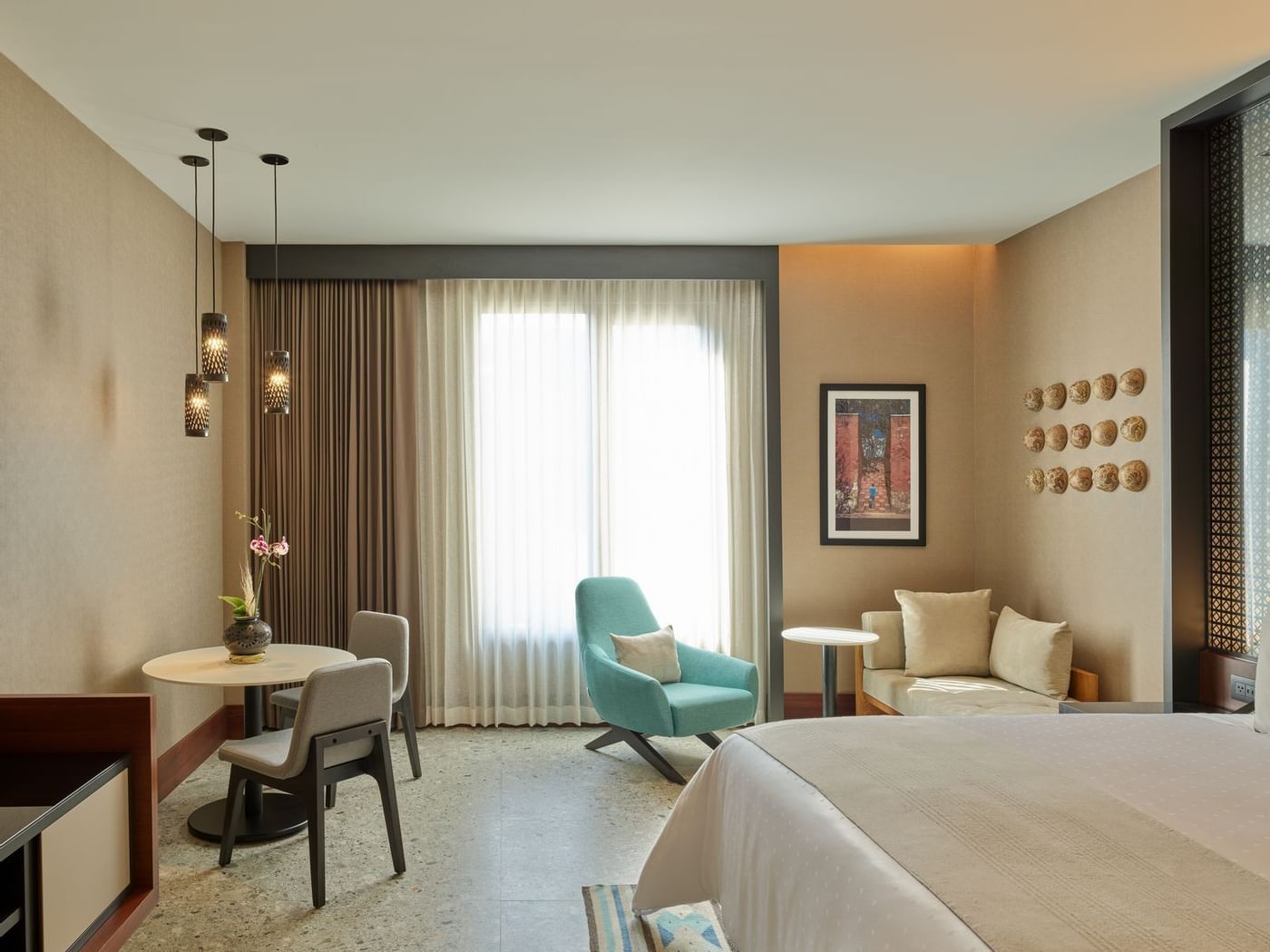 Premium Room with king bed & chairs at Grand Fiesta Americana