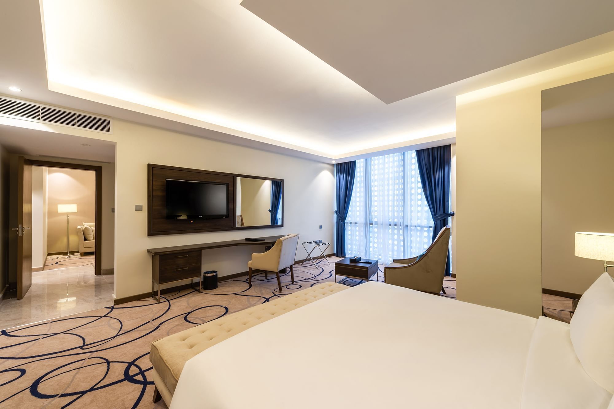 Executive Suite with cozy bed with working area at Warwick Riyadh