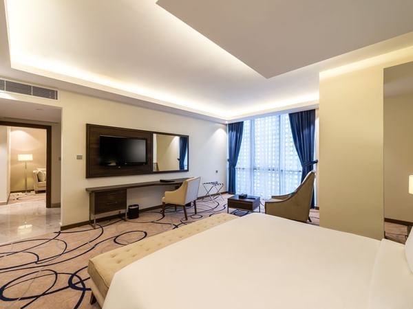 Executive Suite with cozy bed and working area at Warwick Riyadh