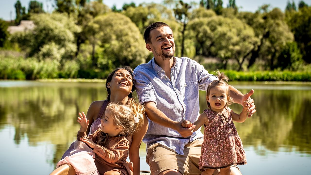 a happy family by a lake in Abbotsford, BC