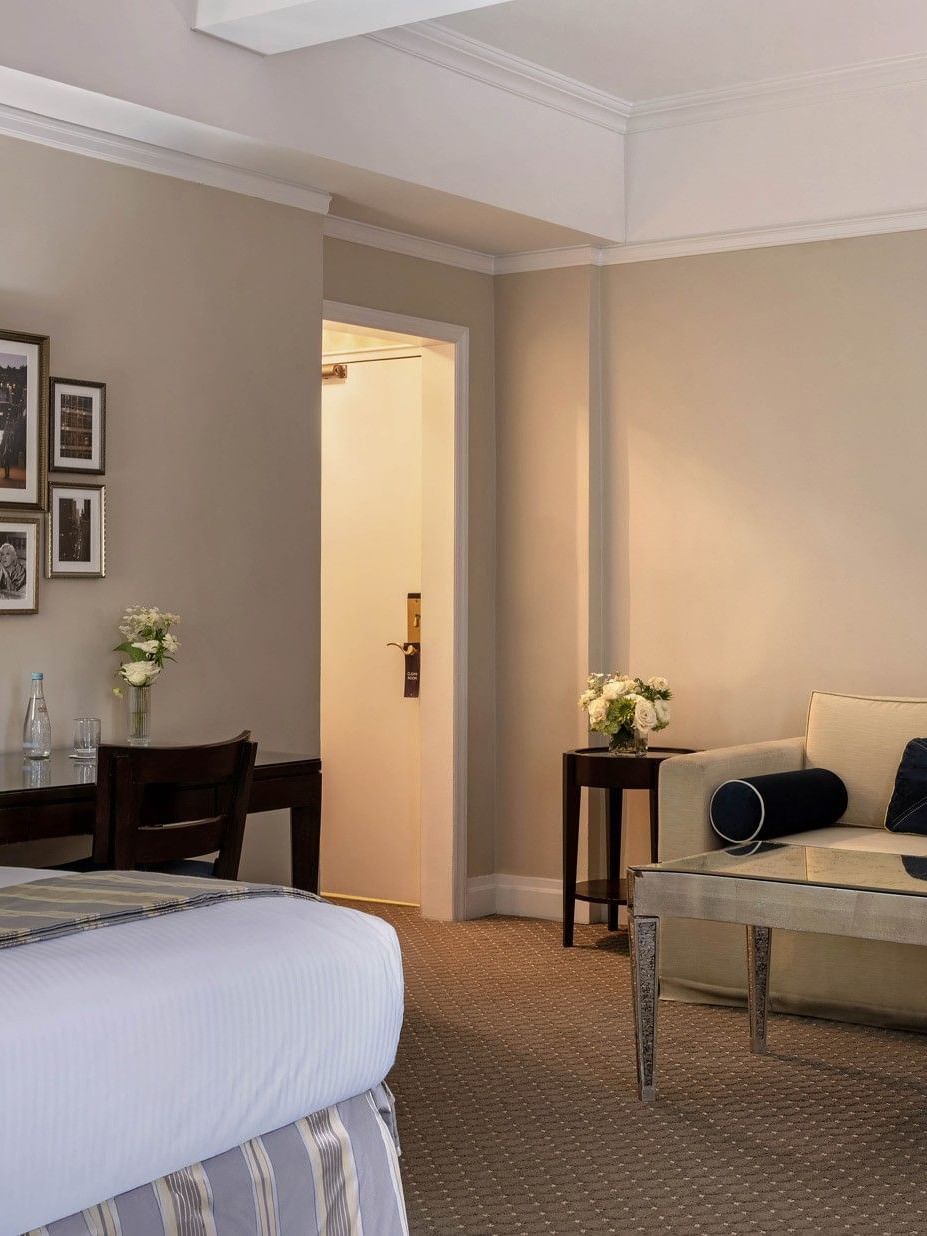 Cream sofa &, mirrored coffee table, and a dark wood desk in Premier City View with Terrace at Warwick New York 