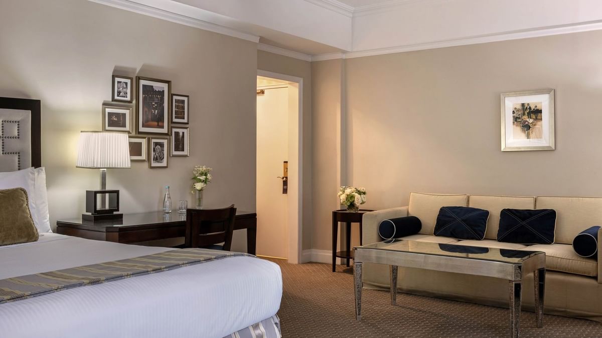 Cream sofa &, mirrored coffee table, and a dark wood desk in Premier City View with Terrace at Warwick New York 