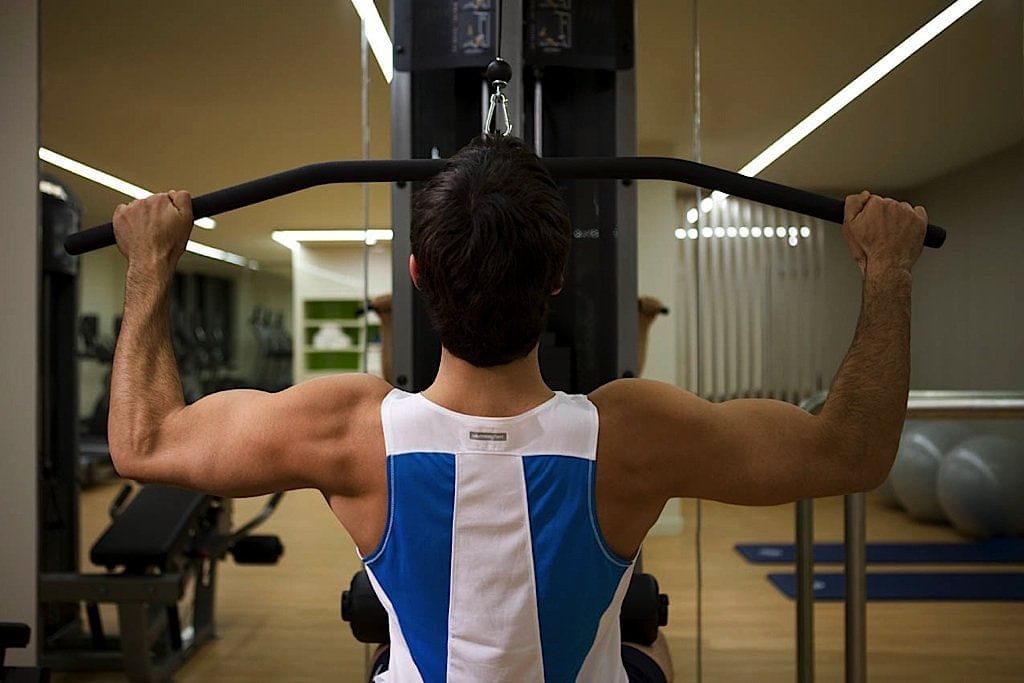 Man exercising in the gym at Pullman Sydney Olympic park 